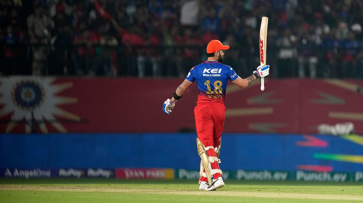 Royal Challengers Bengaluru's Virat Kohl celebrates his fifty runs during the Indian Premier League cricket match between Punjab Kings and Royal Challengers Bengaluru in Dharamsala. - AP Photo /Ashwini Bhatia