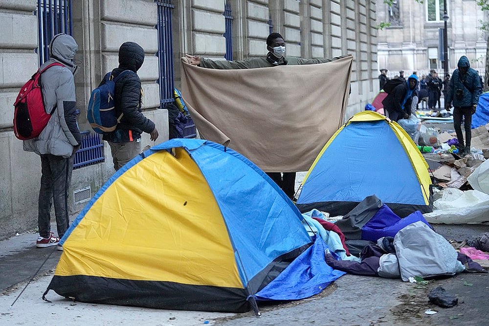 | Photo: AP/Michel Euler : OLY Paris 2024 Migration