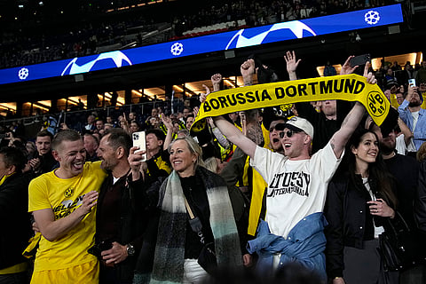 Borussia's Julian Ryerson celebrates with fans