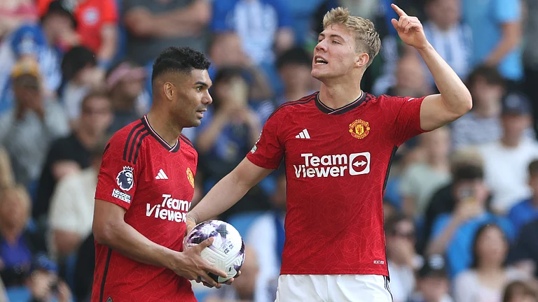 Rasmus Hojlund celebrates scoring Manchester United's second goal at the Amex Stadium - null