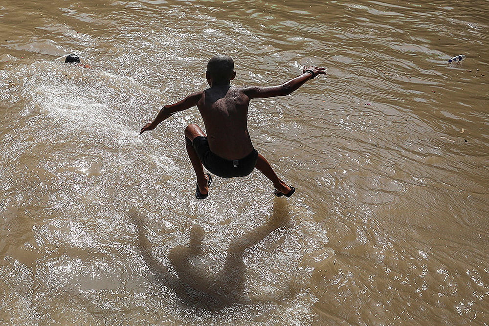 Heatwave: Boy cools off in Jammu