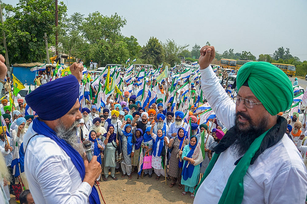 Photo: PTI : Farmers protest against PM Modi's rally