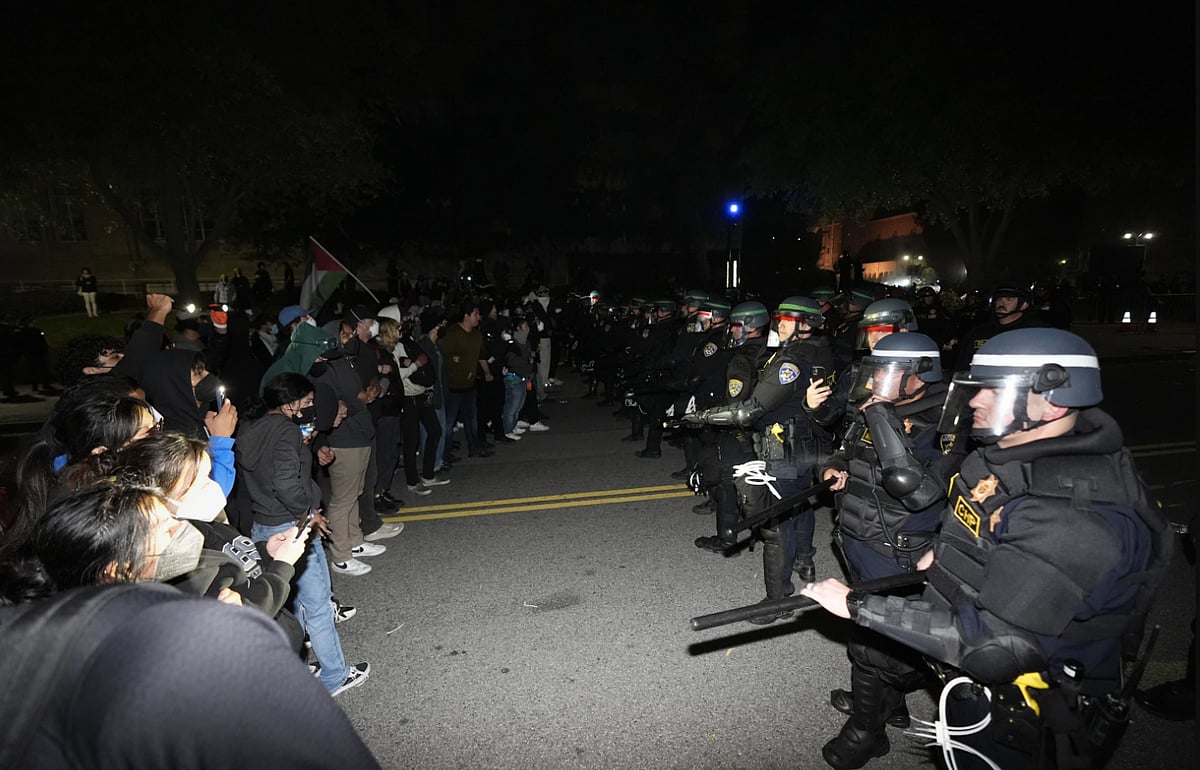 AP : Police in riot gear massed on the UCLA campus and ordered a large group of pro-Palestinian demonstrators inside a fortified encampment to leave the area or face arrest late Wednesday. 