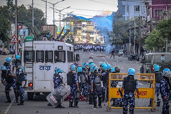 Security personnel fire tear gas as students protest against the killing of two missing students and to demand peace in India's northeastern state of Manipur amid ongoing ethnic violence, in Imphal on September 27, 2023. 

 -  (Photo via Getty Images)