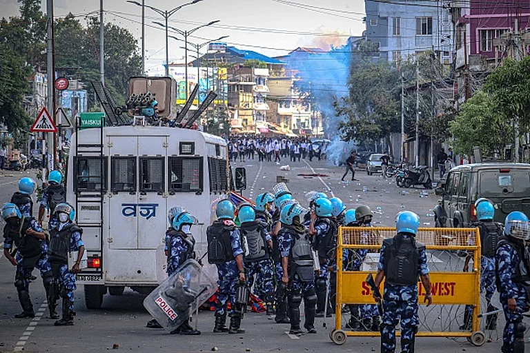 Security personnel fire tear gas as students protest against the killing of two missing students and to demand peace in India's northeastern state of Manipur amid ongoing ethnic violence, in Imphal on September 27, 2023.
- (Photo via Getty Images)