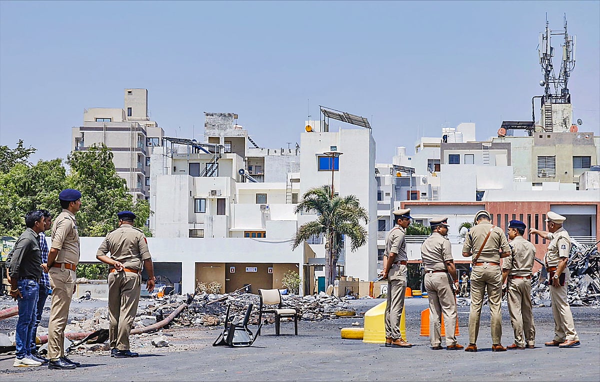 (PTI Photo) : Brijesh Kumar Jha, new Rajkot Commissioner of Police, visits the game zone site where at least 27 were killed in a fire on Saturday evening, in Rajkot, Tuesday, May 28, 2024. 