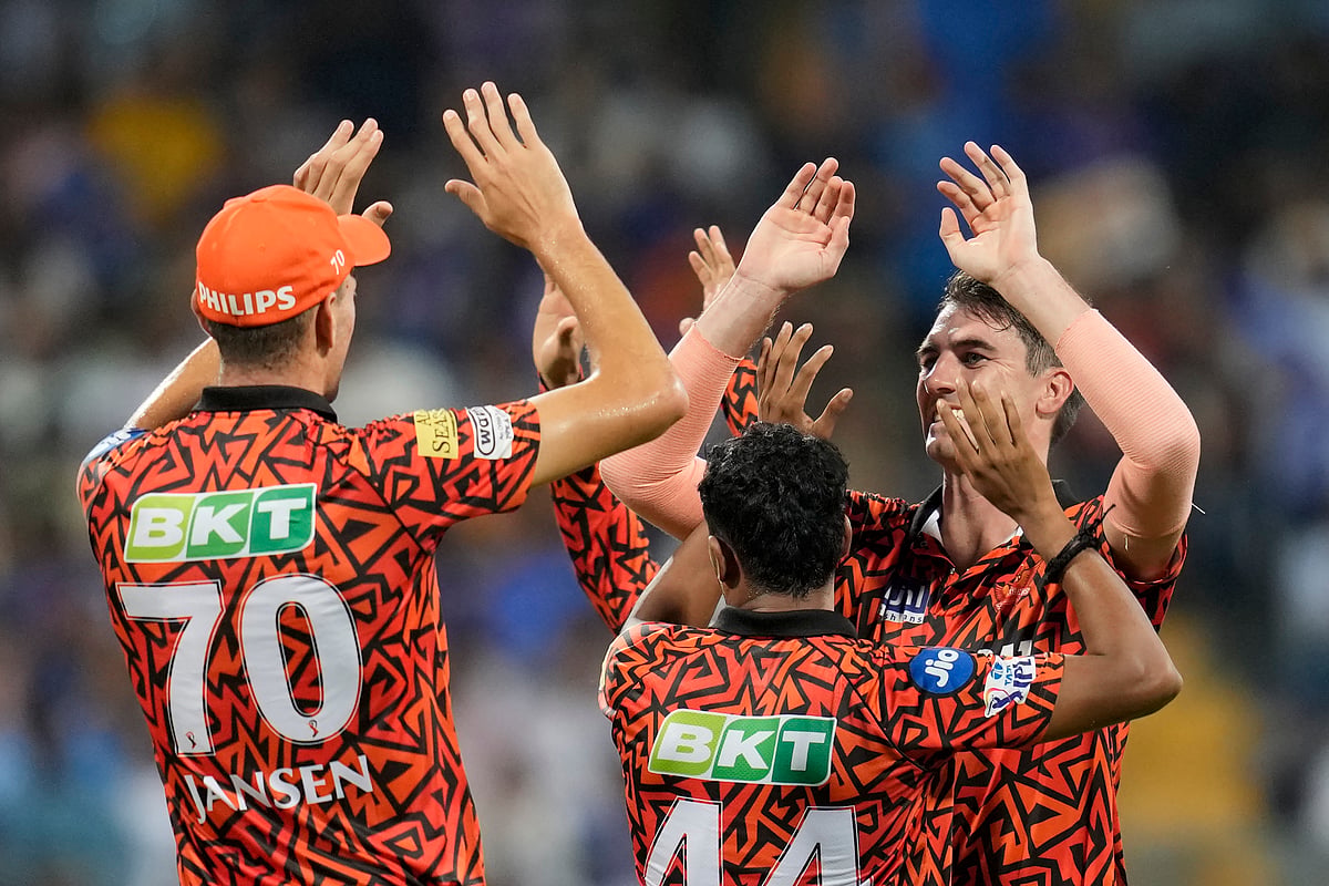 Sunrisers Hyderabad's captain Pat Cummins, right, celebrates the wicket of Mumbai Indians' Rohit Sharma with teammates during their Indian Premier League 2024 match in Mumbai on May 6, 2024. - Rajanish Kakade/AP