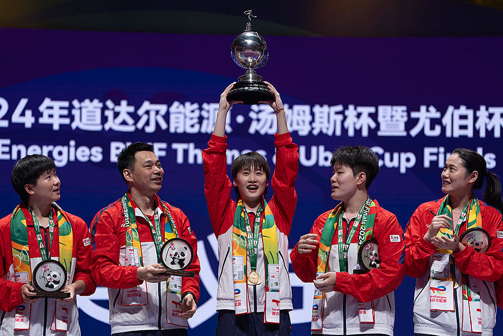 Photo: AP/Ng Han Guan : China Women's Team Badminton