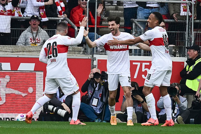 Stuttgarts Deniz Undav, scorer Leonidas Stergiou and Jamie Leweling celebrate the first goal