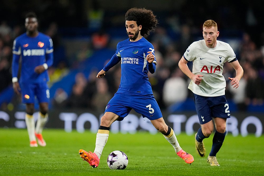 Chelseas Cucurella challenged by Kulusevski