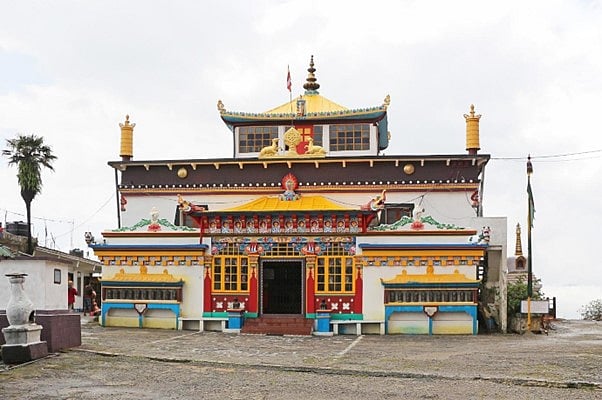 Ghoom Monasterys colorful building with grand roof.