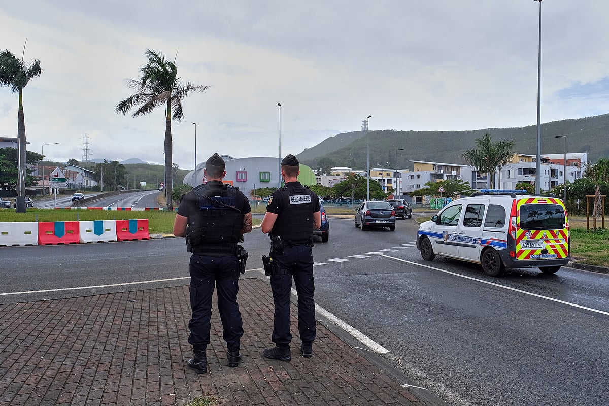 Photo: AP : French gendarme stand guard in capital Noumea amid unrest in the island territory.