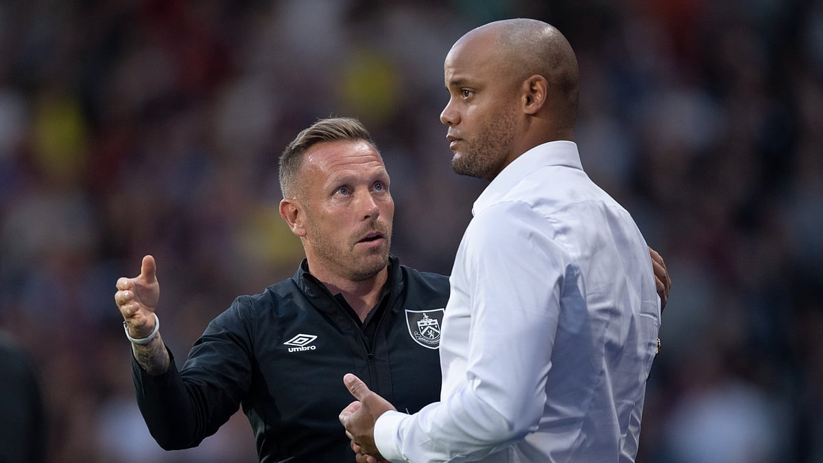 Craig Bellamy and Vincent Kompany. - null