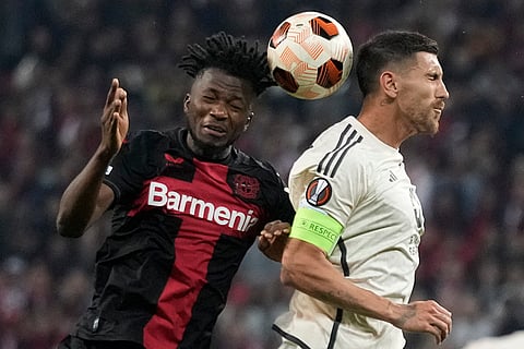 Edmond Tapsoba, left, and Lorenzo Pellegrini