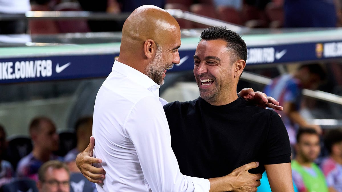 Xavi and Pep Guardiola. - null