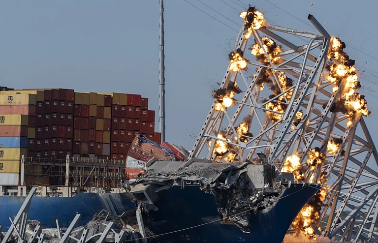 The explosives flashed orange and let off plumes of black smoke upon detonation. - AP