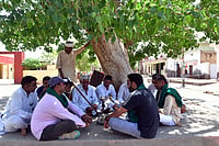 From Rallies To Farms: Capturing The Pulse Of India's Electoral Battlegrounds Photo via Tribhuvan Tiwari for Outlook : Farmers of Sirsa Discussing Elections