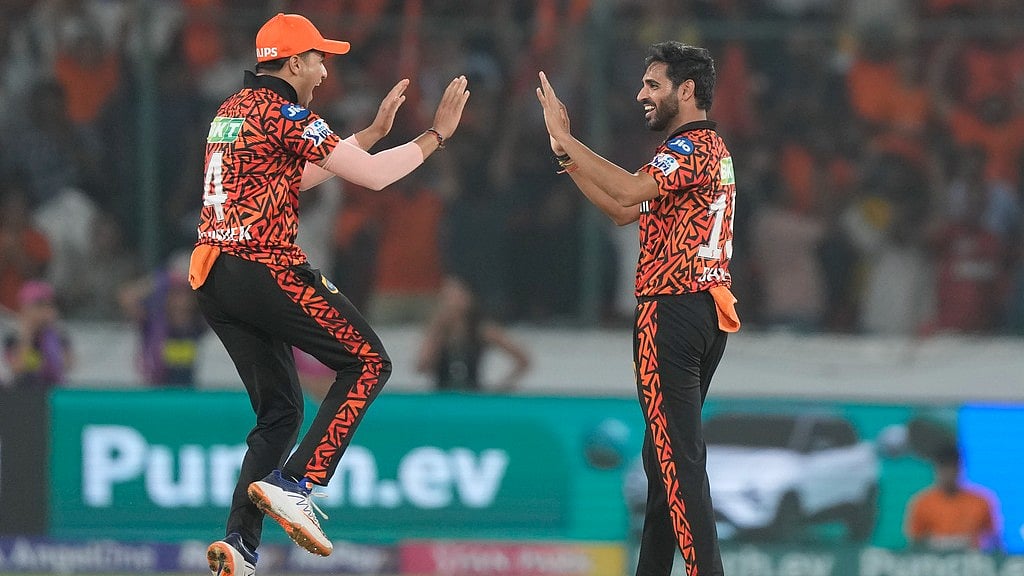 IPL 2024: SRH bowler Bhuvneshwar Kumar celebrates a wicket with Abhishek Sharma (left). - AP/Mahesh Kumar A.