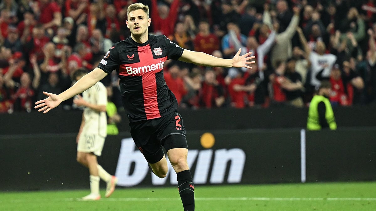 Josip Stanisic celebrates his stoppage-time equaliser against Roma - null