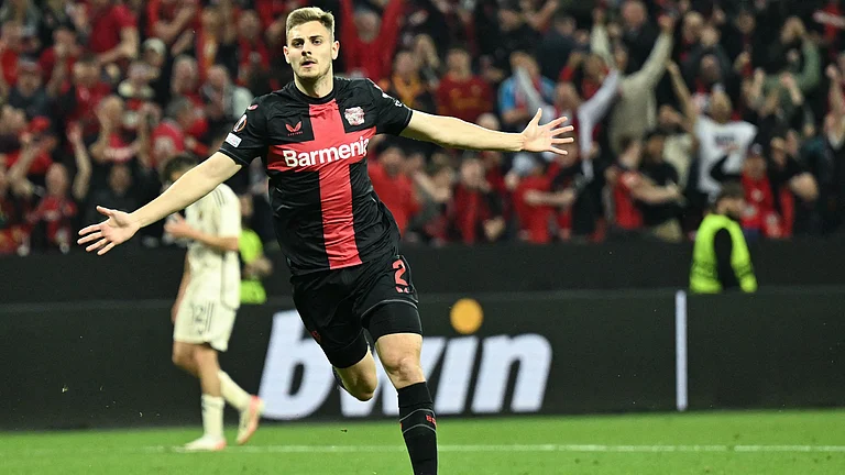 Josip Stanisic celebrates his stoppage-time equaliser against Roma - null