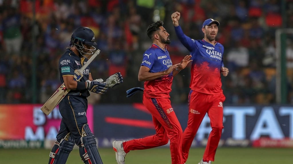 Royal Challengers Bengaluru's Mohammed Siraj, center, and Maxwell celebrates the dismissal of Gujarat Titans' Wriddhiman Saha, left, during the Indian Premier League cricket match between Royal Challengers Bengaluru and Gujarat Titans in Bengaluru, India, Saturday, May 4, 2024.  - AP Photo 