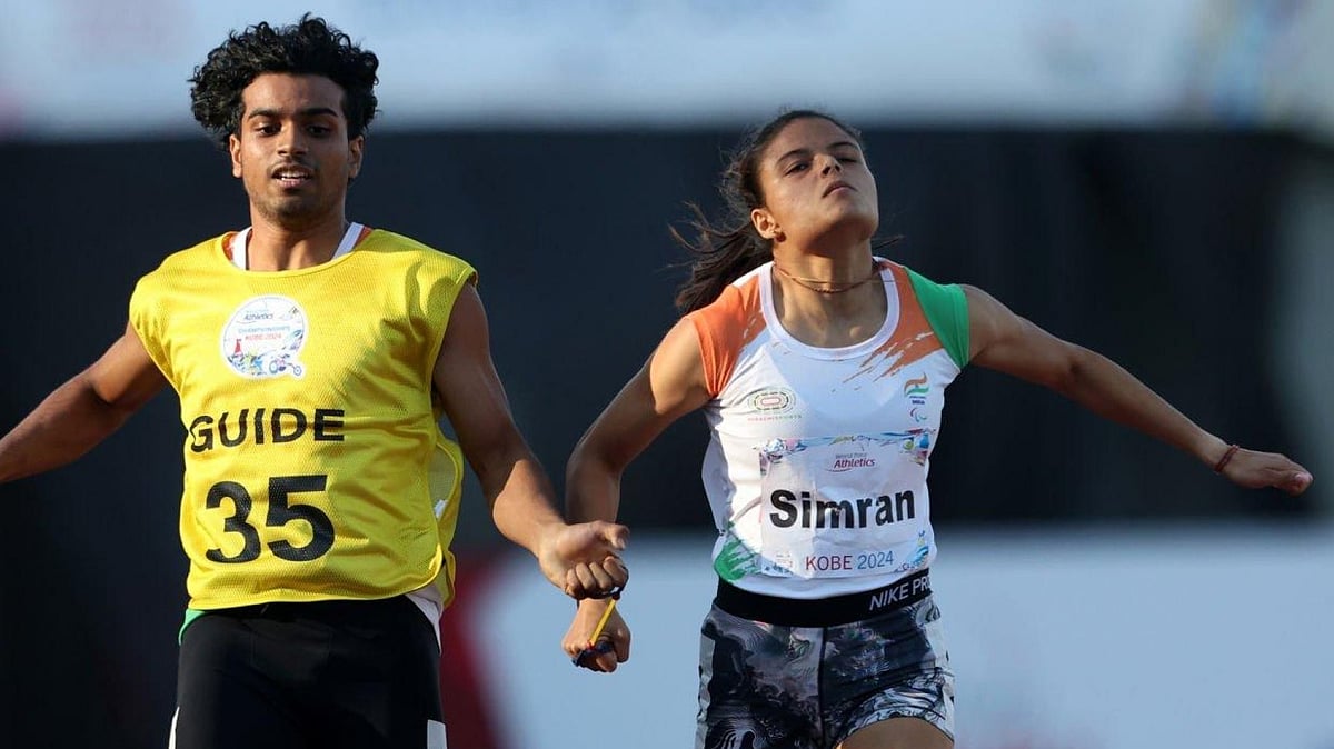 Photo: X/ @anshul_chavhan : Simran Sharma (R) secures India's Paralympic spot in the women's T12 200m event after winning a gold medal at the 2024 World Para Athletics Championships in Kobe, Japan on Saturday.