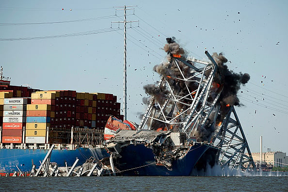 The Army Corp. of Engineers sets off a controlled demolition to remove wreckage from the Francis Scott Key Bridge off of the cargo ship Dali in the Patapsco River on May 13, 2024 in Baltimore, Maryland. An estimated 500-foot section of the bridge weighing 8-12 million pounds was removed by controlled demolition in the final stage of wreckage removal for the ship to be moved into port. On March 26th the Dali crashed into the Key Bridge causing it to collapse killing six construction workers.  - Getty Images