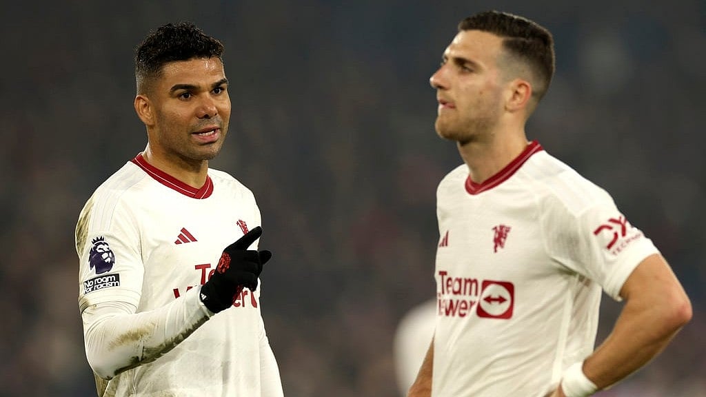 AP : Manchester United's Casemiro, left, and Manchester United's Diogo Dalot react disappointed after the English Premier League soccer match between Crystal Palace and Manchester United.