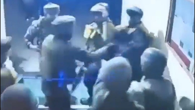 Screengrab of the cops vs army soldiers tussle from the purported video. - X