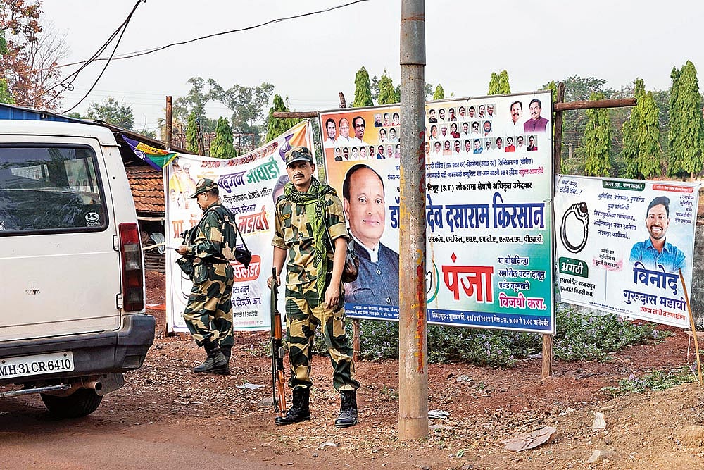 Photo: Dinesh Parab : CRPF personnel guard a main road in Gadchiroli ahead of the first phase of voting