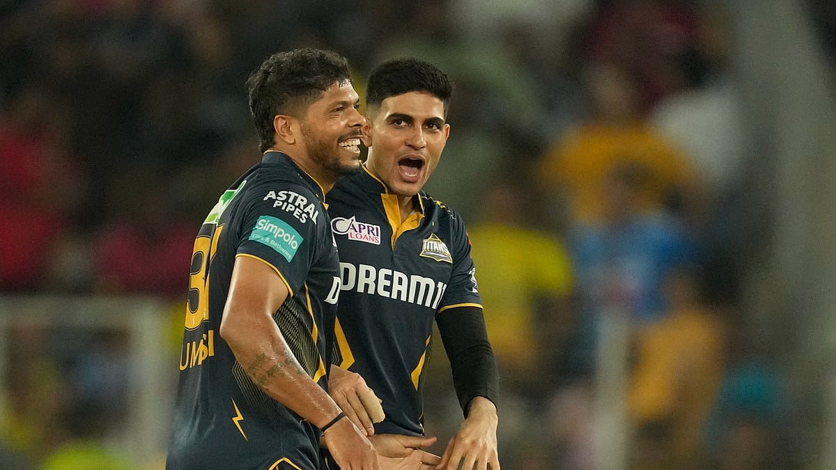 AP Photo/Ajit Solanki : Gujarat Titans' captain Shubman Gill and Umesh Yadav celebrate
