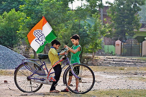 Different Hues: Children sporting a Congress party flag at a campaign meeting for K L Sharma, Amethi’s Congress candidate
