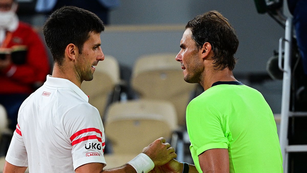 Novak Djokovic and Rafael Nadal meet at the net after their epic clash - null