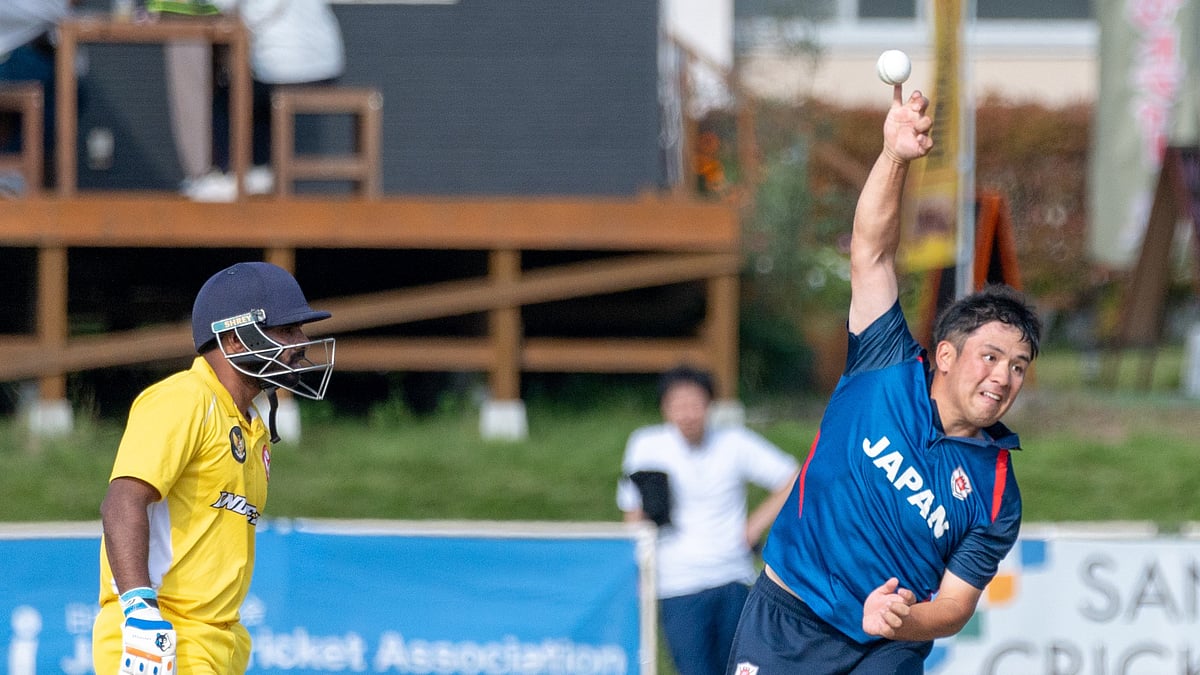 Photo: X/ @CricketJapan : Japanese player bowling in a cricket match.