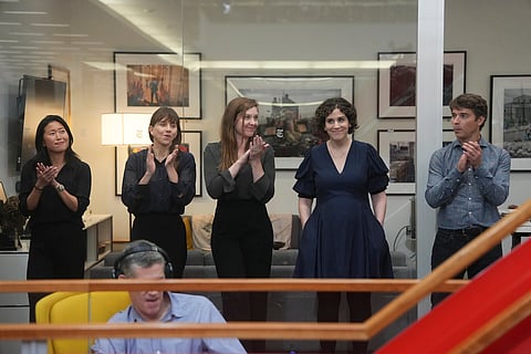 Hannah Dreier, second from right, as colleagues applaud during a Pulitzer Prize gathering in the newsroom of The New York Times in New York, Monday, May 6, 2024.