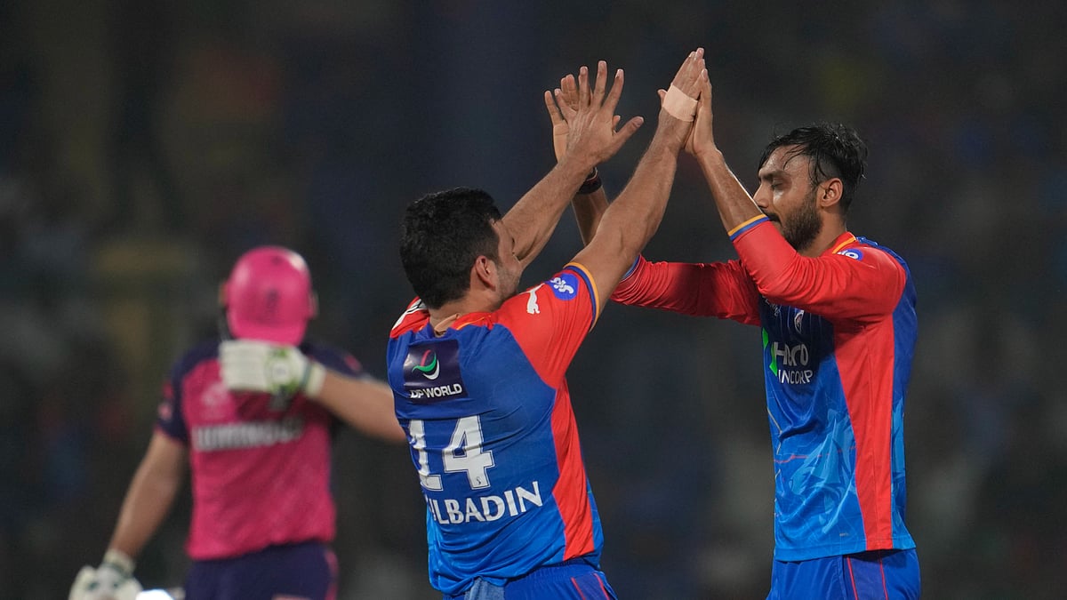Axar Patel celebrating a wicket with Gulbadin Naib in IPL 2024. AP Photo