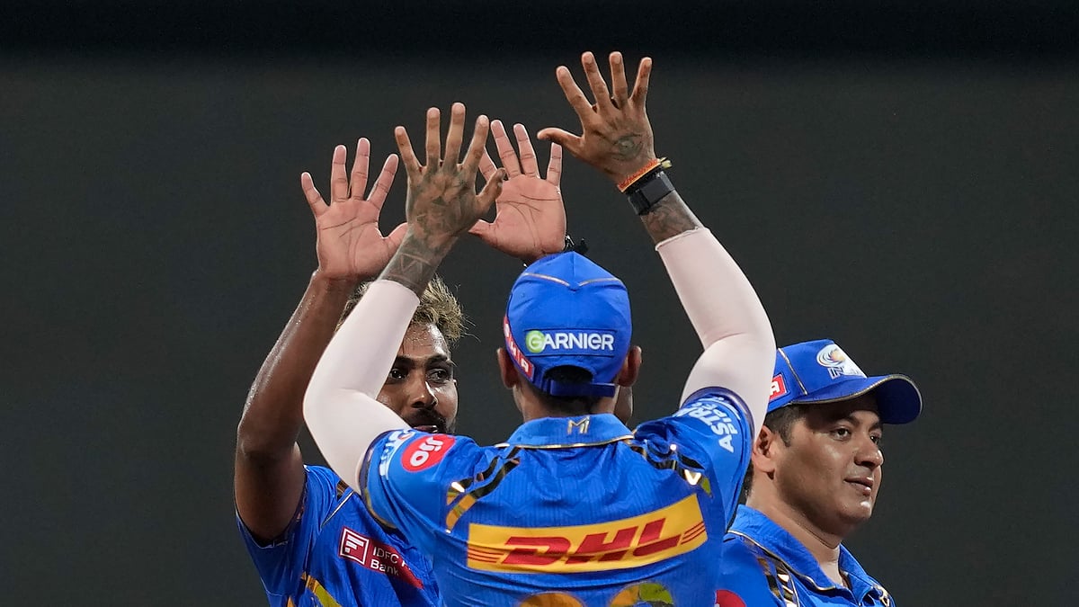 MI teammates celebrating a wicket in IPL 2024. AP Photo