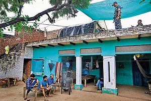 Photo: Suresh K. Pandey : CRPF jawans have been guarding the deceased girl's house since the incident. The family members say their presence has made them prisoners inside their own home
