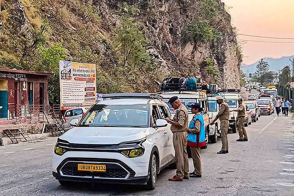 Police check the registration of Char Dham pilgrims