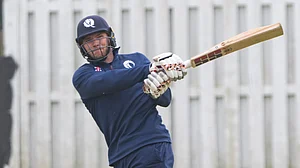 Photo: X/ @CricketScotland : Scotland batter playing a shot during the warm-up game of the ICC T20 World Cup 2024.