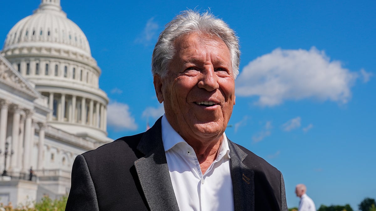 AP : Formula One racing legend Mario Andretti talks to fans following a news conference at the Capitol in Washington.