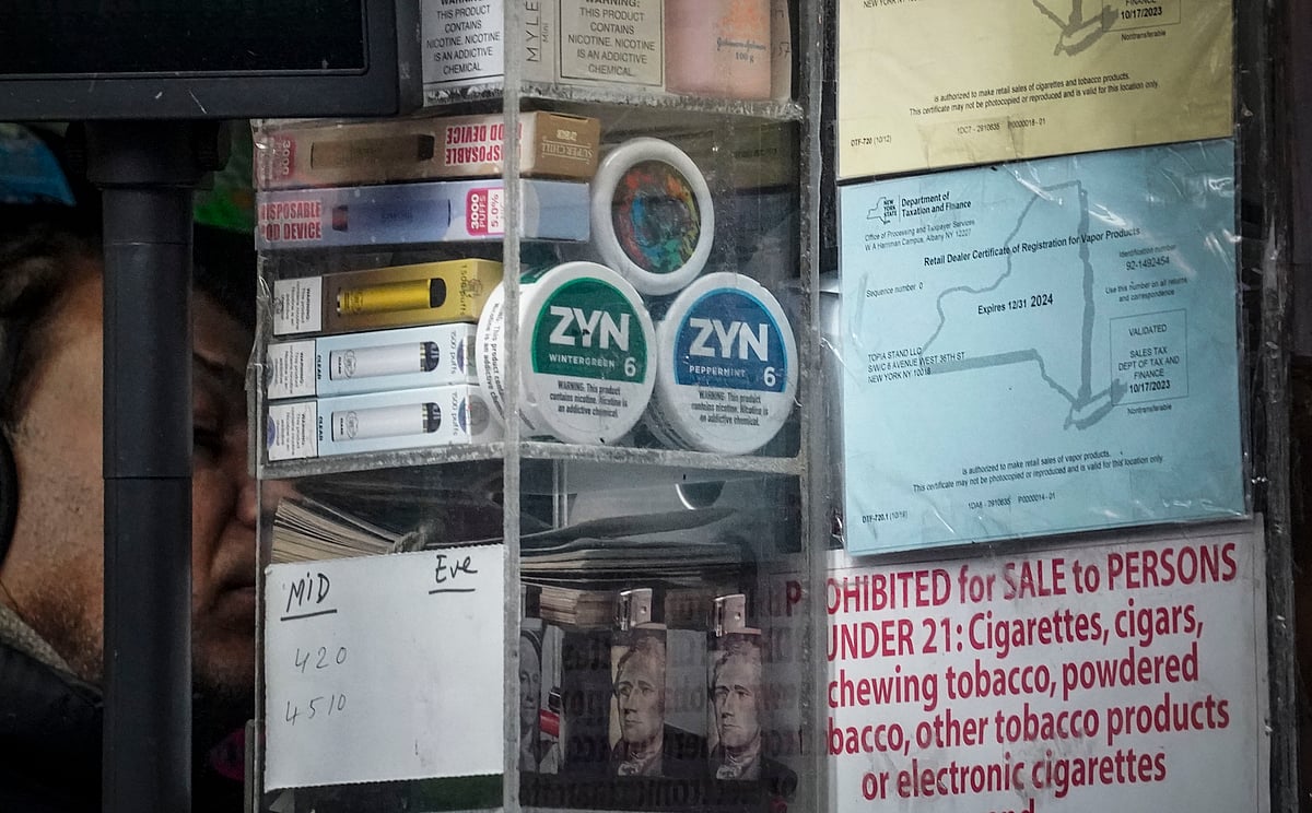 Bebeto Matthews / AP : Containers of Zyn, a Phillip Morris smokeless nicotine pouch, are stacked for sale at a newsstand. 