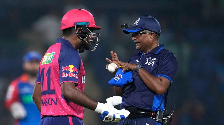 Rajasthan Royals' captain Sanju Samson talks to umpire after getting out during the Indian Premier League cricket match between Delhi Capitals and Rajasthan Royals in New Delhi, India, Tuesday, May 7, 2024. - (AP Photo/Manish Swarup)