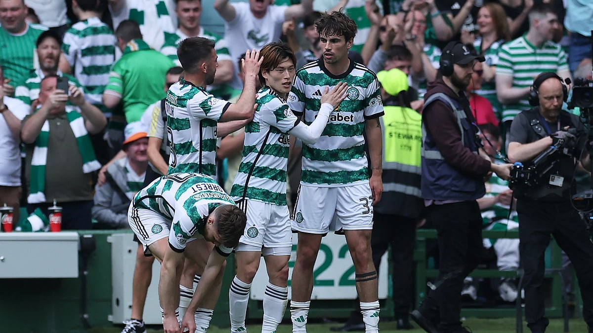 Celtic players celebrate a goal.
