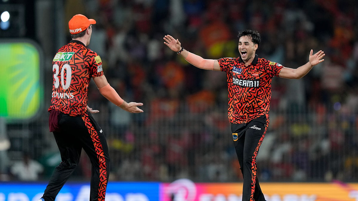 Sunrisers Hyderabad's Abhishek Sharma celebrates with captain Pat Cummins the wicket of Rajasthan Royals' captain Sanju Samson during the Indian Premier League second qualifier cricket match between Rajasthan Royals and Sunrisers Hyderabad in Chennai. - AP Photo /Mahesh Kumar A.