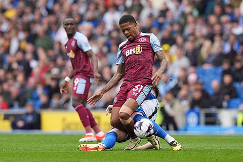 Leon Bailey is tackled by Billy Gilmour