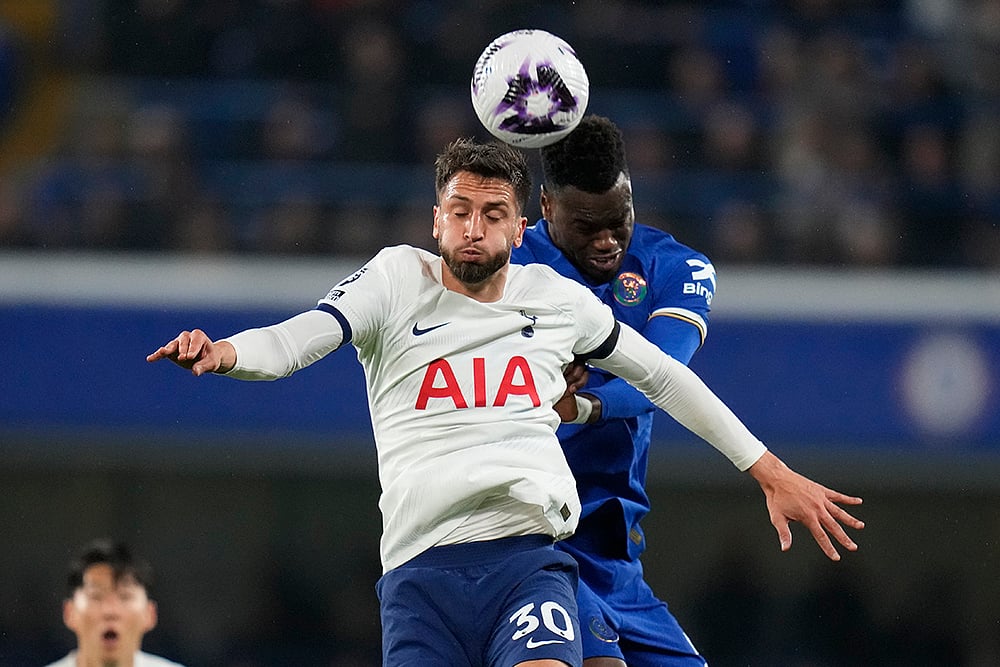 Tottenhams Bentancur jumps for a header