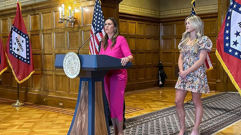 Arkansas Gov. Sarah Huckabee Sanders speaks at a news conference next to former Kentucky swimmer Riley Gaines at the state Capitol in Little Rock, Ark., Thursday, May 2, 2024. - AP