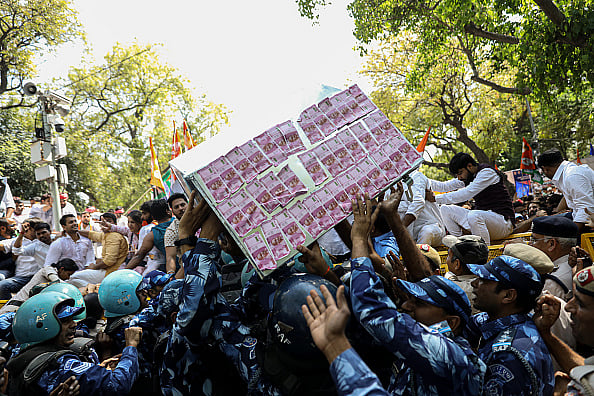 Getty Images : A box of fake currency notes amid protest over Adani Group issue and Rahul Gandhi's disqualification in March, 2023