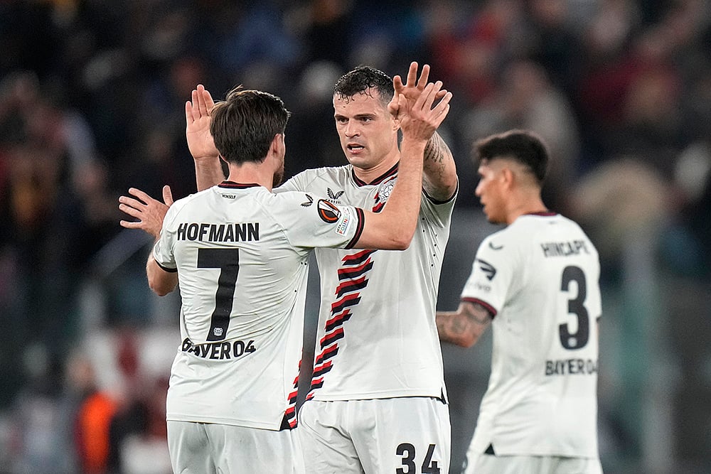 Leverkusens Jonas Hofmann and Granit Xhaka celebrate their victory